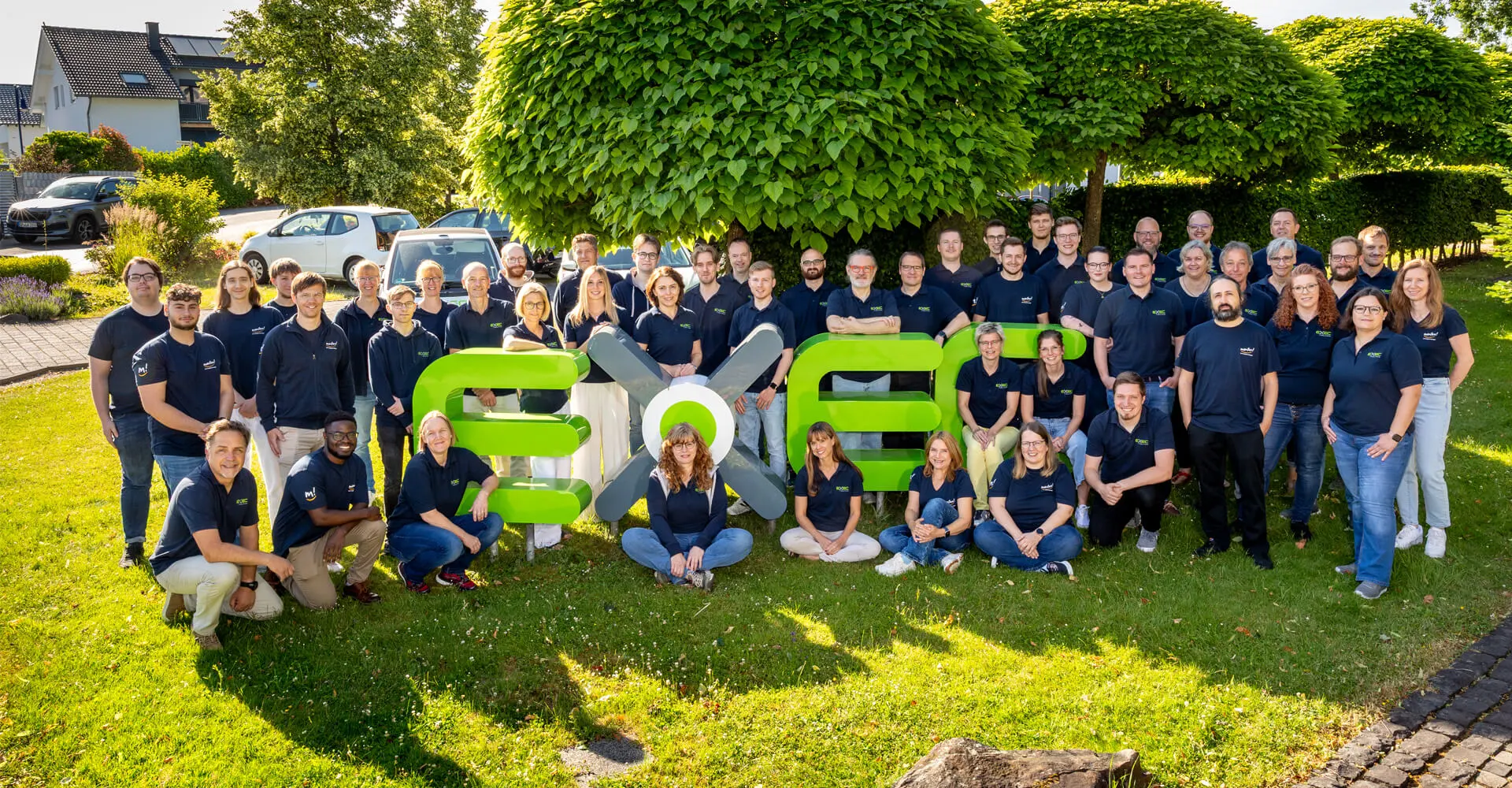 EXEC Gruppenfoto Mitarbeitende